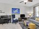 Stylish living room featuring a piano, accent chair and comfortable sofas at 6741 Citrus Creek Ln, Tampa, FL 33625