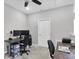 Functional office space with two desks, dual monitors, and a ceiling fan at 6741 Citrus Creek Ln, Tampa, FL 33625