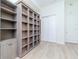 Bright bedroom featuring a built-in bookcase, closet, and neutral decor at 700 S Harbour Island Blvd # 807, Tampa, FL 33602