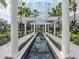 Picturesque courtyard with water feature, manicured greenery, seating areas and views of the building at 700 S Harbour Island Blvd # 807, Tampa, FL 33602
