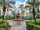 Serene courtyard with tiered fountain, seating area, palm trees, and views of the building at 700 S Harbour Island Blvd # 807, Tampa, FL 33602