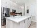 Modern kitchen with white cabinetry, marble countertops, stainless steel appliances, and decorative backsplash at 700 S Harbour Island Blvd # 807, Tampa, FL 33602