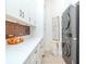 Well-organized laundry room features modern appliances, white cabinets, and quartz countertops at 700 S Harbour Island Blvd # 807, Tampa, FL 33602