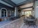 Inviting outdoor patio with tiled flooring, tables, chairs, and views of the courtyard at 700 S Harbour Island Blvd # 807, Tampa, FL 33602
