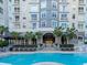 Relaxing poolside view featuring a spacious deck area and building entrance at 700 S Harbour Island Blvd # 807, Tampa, FL 33602