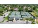 Overhead view of community tennis courts and surrounding foliage at 7106 Green Abbey Way, Spring Hill, FL 34606