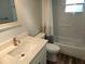 Updated bathroom features a shower-tub combination with white subway tile surround at 7106 Green Abbey Way, Spring Hill, FL 34606