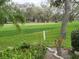 Scenic golf course view provides a tranquil backdrop, perfect for relaxation and recreation at 7106 Green Abbey Way, Spring Hill, FL 34606