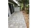 Paver patio extends living space outdoors, offering scenic views and relaxation at 7106 Green Abbey Way, Spring Hill, FL 34606
