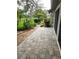 Paver patio extends living space outdoors, offering scenic views and relaxation at 7106 Green Abbey Way, Spring Hill, FL 34606