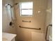 Accessible bathroom shower with safety bars and handheld shower head at 7106 Green Abbey Way, Spring Hill, FL 34606