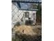 Exterior view of the house with a chain-link fence at 7278 Lamplighter St, Spring Hill, FL 34606