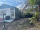 Home featuring mature landscaping, a cozy porch, and a welcoming entrance at 7278 Lamplighter St, Spring Hill, FL 34606