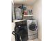 Functional laundry room with modern washer and dryer set plus water heater at 7278 Lamplighter St, Spring Hill, FL 34606