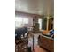 Cozy living room with natural light, eclectic decor and hardwood floors at 7278 Lamplighter St, Spring Hill, FL 34606