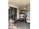 Covered outdoor space, or sunroom, with seating and storage, extending the living area for relaxation and enjoyment at 7278 Lamplighter St, Spring Hill, FL 34606