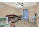 Cozy bedroom displaying a crib, soft carpet, and neutral-toned walls at 9291 Geranium Ave, Spring Hill, FL 34606