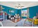 Bright bedroom featuring hardwood floors, natural light, and fun decor at 9291 Geranium Ave, Spring Hill, FL 34606