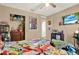 Fun bedroom with a themed bedspread, ceiling fan, and a closet at 9291 Geranium Ave, Spring Hill, FL 34606