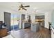 Stylish kitchen with grey cabinetry, an island, and stainless steel appliances at 9291 Geranium Ave, Spring Hill, FL 34606