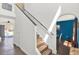 Well-lit staircase with carpeted steps and modern railing, leading to the upper level at 9291 Geranium Ave, Spring Hill, FL 34606