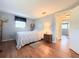 Bedroom with a lamp nightstand and wood flooring at 9512 Sunshine Blvd, New Port Richey, FL 34654