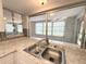 Kitchen sink and granite counters featuring a pass-through window at 9512 Sunshine Blvd, New Port Richey, FL 34654