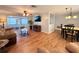 Spacious living room with vinyl flooring and large screened-in porch at 9512 Sunshine Blvd, New Port Richey, FL 34654