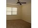 Bedroom featuring neutral walls, carpeted floor and a window with blinds at 10020 Vancouver Rd, Spring Hill, FL 34608