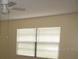Bedroom with neutral walls and a large window with blinds at 10020 Vancouver Rd, Spring Hill, FL 34608