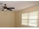 Bright bedroom features a ceiling fan and a window for natural light at 10020 Vancouver Rd, Spring Hill, FL 34608