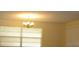 Bright dining area with a charming chandelier and ample natural light at 10020 Vancouver Rd, Spring Hill, FL 34608