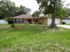 Charming single-story home featuring a well-maintained lawn and mature trees at 10020 Vancouver Rd, Spring Hill, FL 34608