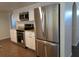 Modern kitchen boasts stainless steel appliances, ample cabinet space, and granite countertops at 10020 Vancouver Rd, Spring Hill, FL 34608