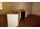 Granite topped kitchen island features modern faucet and stainless steel dishwasher at 10020 Vancouver Rd, Spring Hill, FL 34608