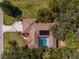 Aerial view of the home showing the pool and patio area, as well as the roof at 10079 Deer St, Spring Hill, FL 34608