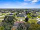 Expansive aerial view of a residential area featuring well-maintained homes and lush green landscaping at 10079 Deer St, Spring Hill, FL 34608