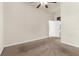 Bedroom with neutral carpet, a ceiling fan and open doorway to another room at 10079 Deer St, Spring Hill, FL 34608