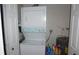 Laundry room equipped with a stacked washer and dryer, providing convenience for laundry tasks at 11140 Carriage Hill Dr # 3, Port Richey, FL 34668