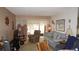 Inviting living area with cozy furniture, a tv and a view to the outdoors at 11140 Carriage Hill Dr # 3, Port Richey, FL 34668
