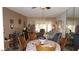 Cozy living room with a mirrored wall reflecting the dining area, creating a spacious feel at 11140 Carriage Hill Dr # 3, Port Richey, FL 34668