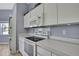 Cozy kitchen with white appliances, cabinets and light countertops at 11257 Frigate Bird Ave, Weeki Wachee, FL 34613