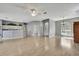 Bright living room featuring an open floor plan, light gray walls, and wood-look floors at 11257 Frigate Bird Ave, Weeki Wachee, FL 34613