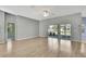 Spacious living room with lots of natural light and wood flooring at 11257 Frigate Bird Ave, Weeki Wachee, FL 34613