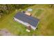 This aerial view shows the home with the above-ground pool and large deck at 13024 Mohican Ave, New Port Richey, FL 34654