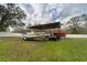 Spacious backyard featuring boat storage, offering ample space for outdoor activities at 13024 Mohican Ave, New Port Richey, FL 34654