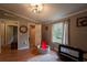 Playful bedroom featuring wood floors, multiple doors, a ball pit and a kid slide at 13024 Mohican Ave, New Port Richey, FL 34654