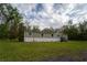 A charming single-story home with a well-maintained lawn and classic siding at 13024 Mohican Ave, New Port Richey, FL 34654