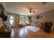 Cozy living room with large windows offering ample natural light and comfortable seating at 13024 Mohican Ave, New Port Richey, FL 34654