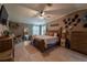 Bright main bedroom with a king bed, neutral decor, and ample closet space at 13024 Mohican Ave, New Port Richey, FL 34654